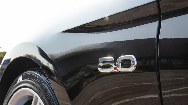 Close up of 5.0 badge on black Ford Mustang GT