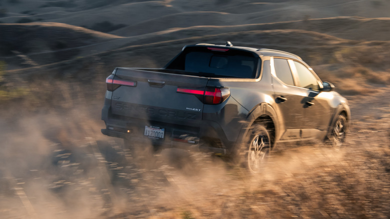 Rear view of Hyundai Santa Cruz XRT on mountain trail.