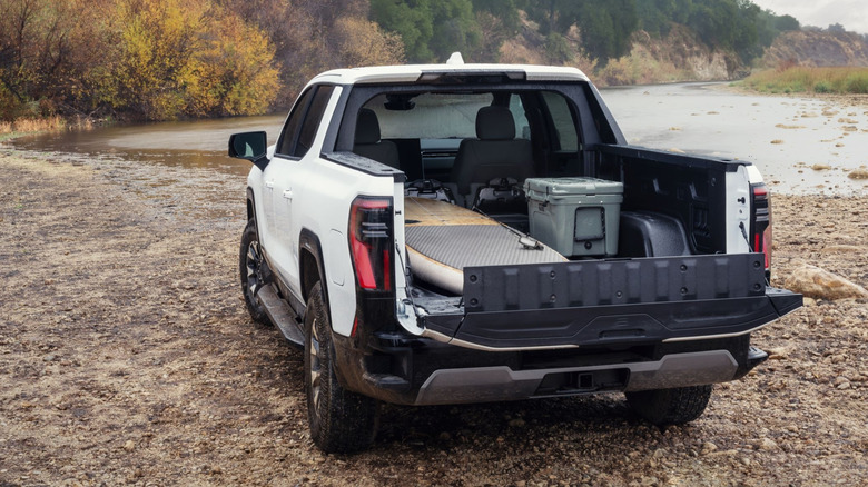 Rear view of GMC Sierra EV pickup with midgate lowered.