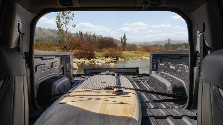 View from inside GMC Sierra EV cab looking out through midgate.