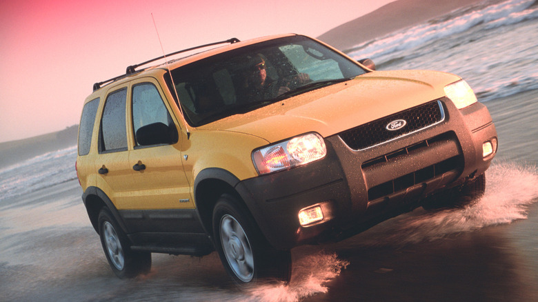 2001 Ford Escape driving through water on beach, front-right view