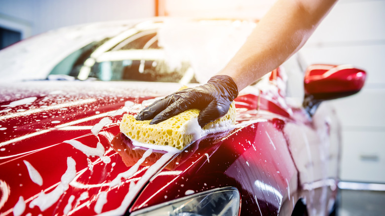 person washing a car