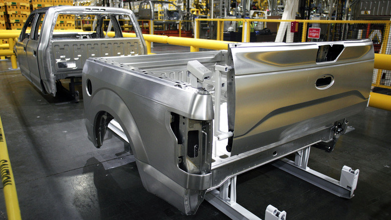 Rear view of aluminum Ford F-150 body panels on assembly line.