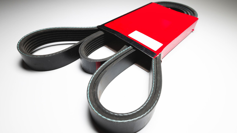 Serpentine belt in packaging on white table