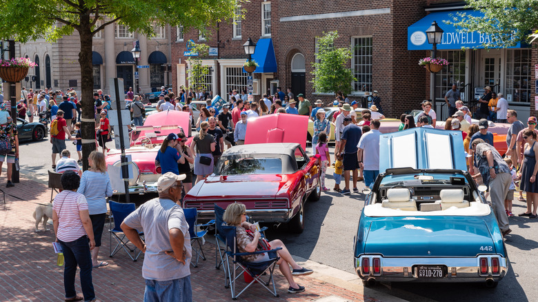 People admiring old classic cars at the 2019 Old Town Festival of Speed & Style event.