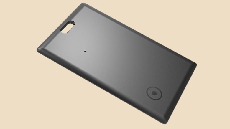 Novzix S11 card-shaped wallet tracker - a black credit-card shaped device with a round logo and lanyard hole.