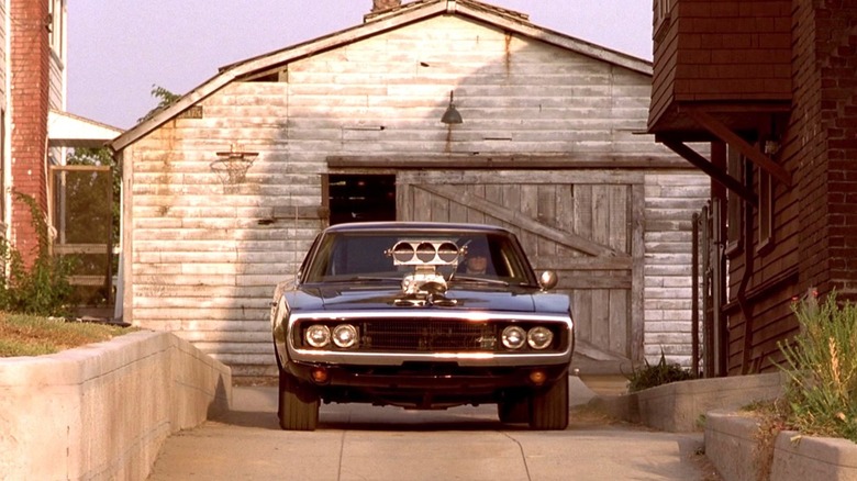 Dom Toretto taking the 1970 Dodge Charger R/T out of the garage in The Fast and the Furious