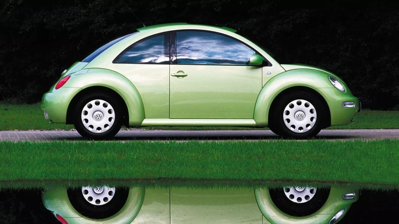 Green New Beetle reflected in the water