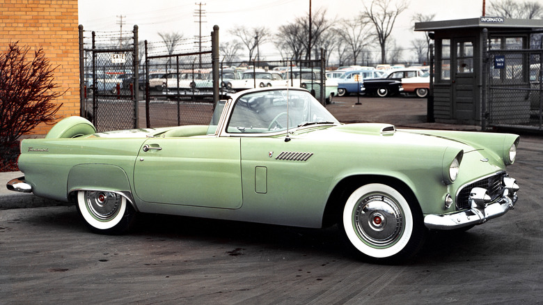 A green 1956 Ford Thunderbird convertible.