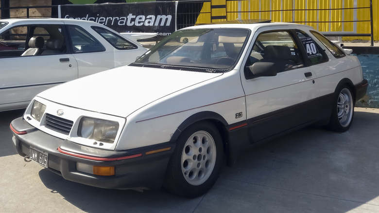 White Merkur XR4Ti in a parking lot
