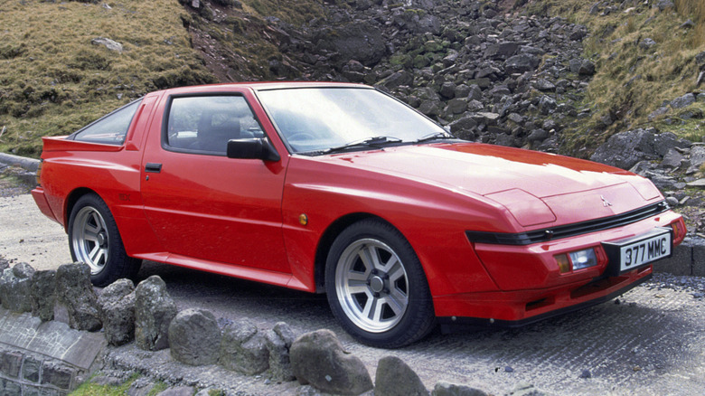 Red Mitsubishi Starion on a mountain road