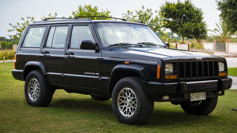 XJ Jeep Cherokee parked on a lawn