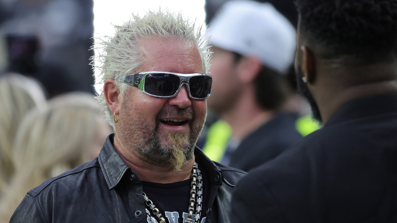 Guy Fieri smiling with sunglasses