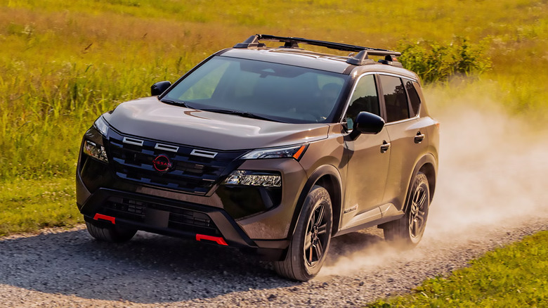 A 2025 Nissan Rogue Rock Creek drivng off-road