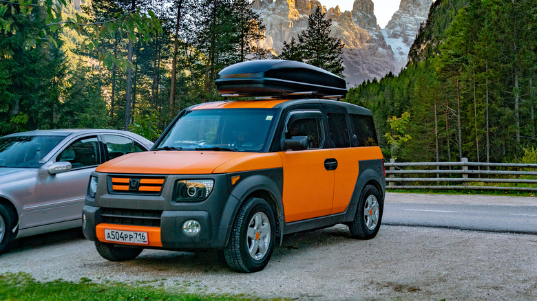 Orange Honda Element in the Alps