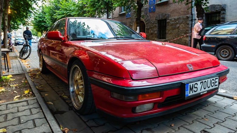 Red Honda Prelude on street in Romania