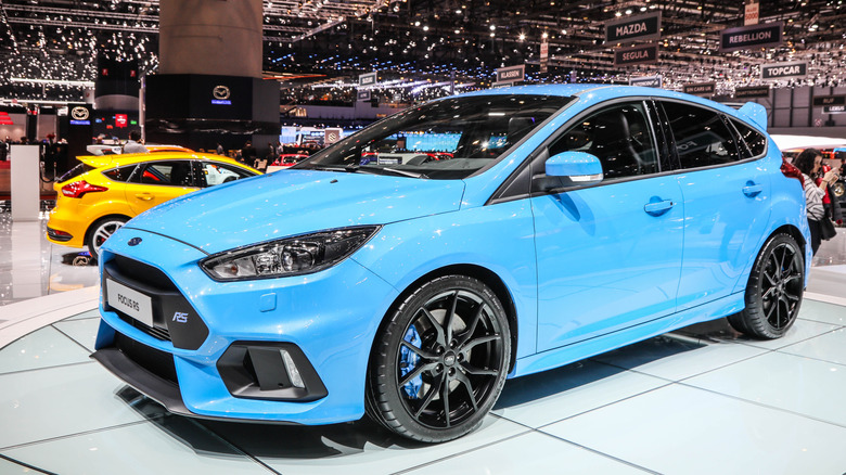 Front 3/4 view of blue Ford Focus RS on display at auto show.