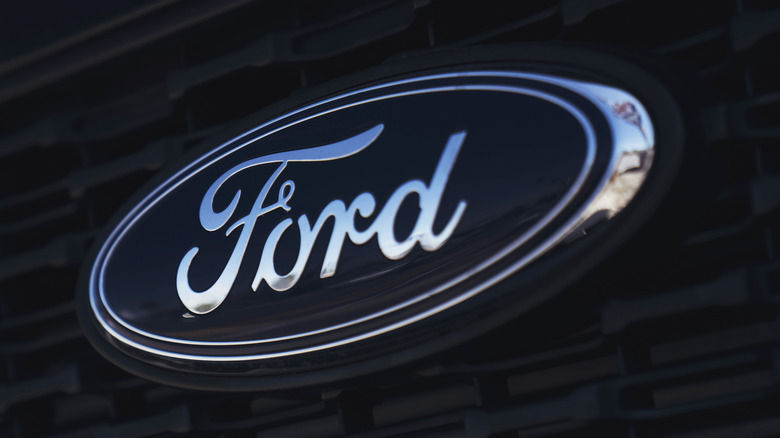Close up view of Ford emblem on vehicle grille.