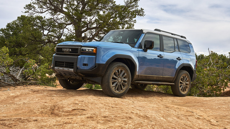 Blue 2026 Toyota Land Cruiser on dirt path in vineyard