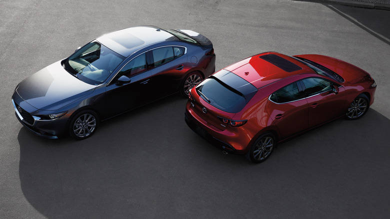 Overhead view of Mazda 3 sedan and hatchback in paved setting