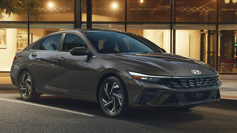 Front 3/4 view of 2026 Hyundai Elantra in urban setting