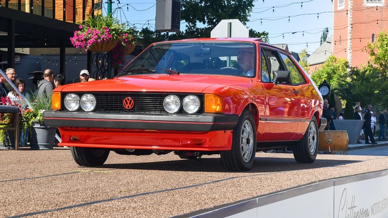 Red 1981 Volkswagen Scirocco seen from front left in a street scene