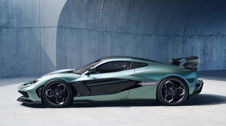 Green Rimac Nevera R in front of a concrete wall