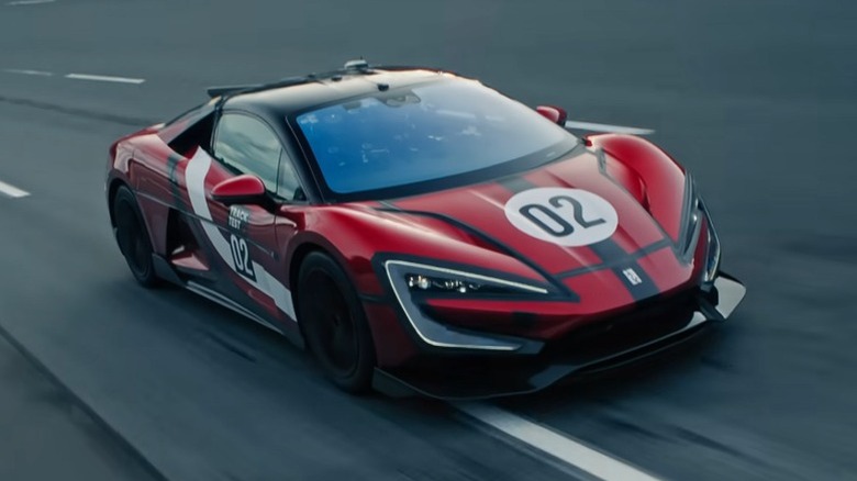 Red and black Yangwang U9 Xtreme performing a high-speed run