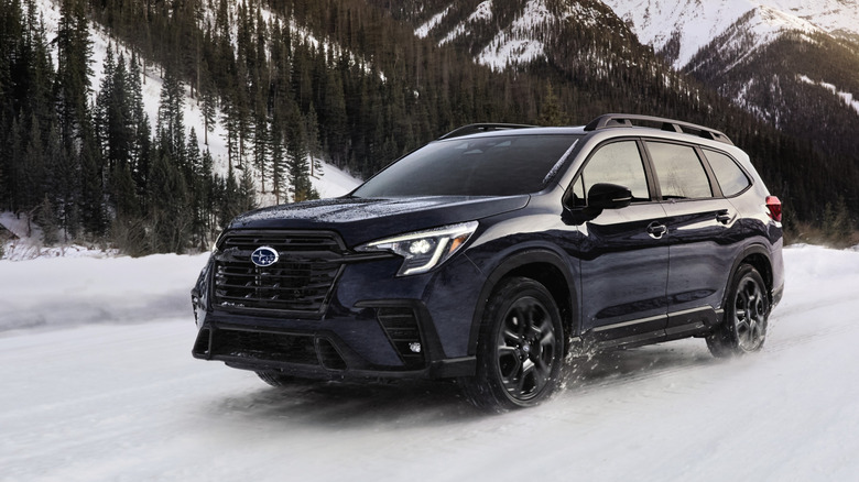 Front 3/4 view of gray Subaru Ascent SUV driving in the snow.
