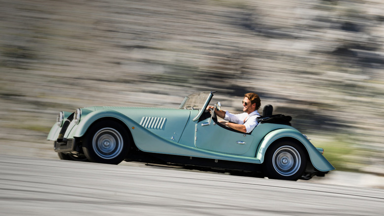2020 Morgan Plus Four driving at speed, left-side view