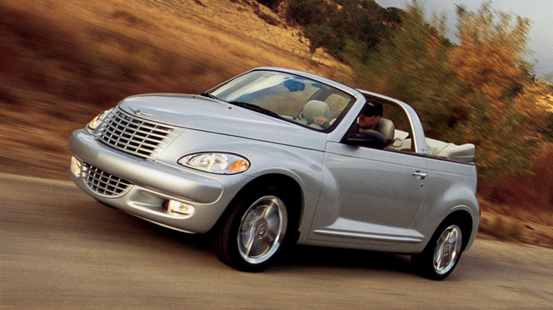 2004 Chrysler PT Cruiser GT convertible driving on desert road, front-left 3/4 view