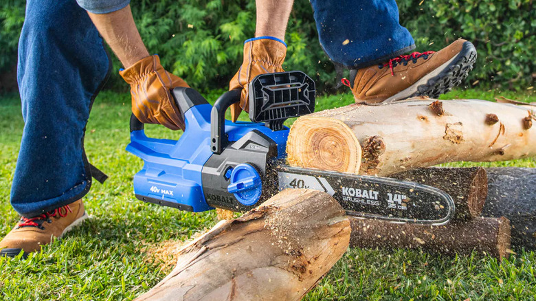 Kobalt 40V chainsaw sending sawdust flying