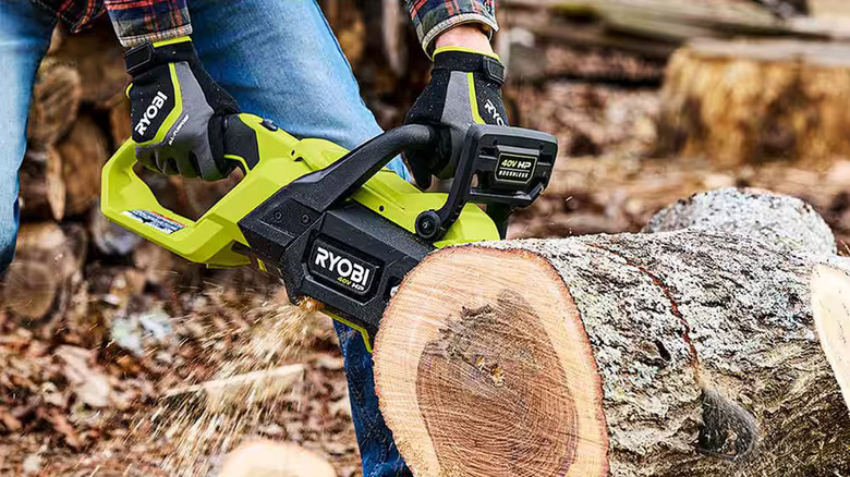 Ryobi 40V HP chainsaw tackling a large cut