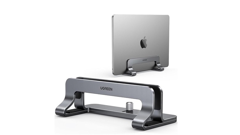 Ugreen vertical laptop stand with macbook on white background.