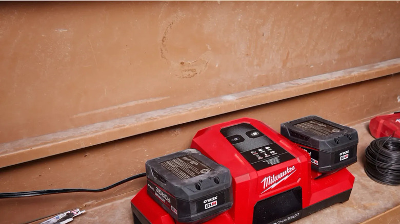 Milwaukee M18 batteries docked in a Super Charger.