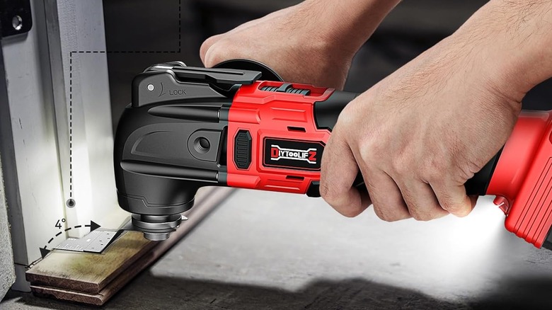 A person using a DIYtoolifz Cordless Oscillating Tool.