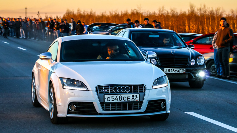 Mercedes-Benz E55 AMG racing an Audi TTS
