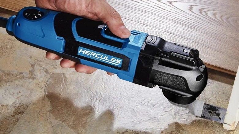 Person cutting trim with Hercules 3.5 Amp Variable Oscillating Multi-Tool