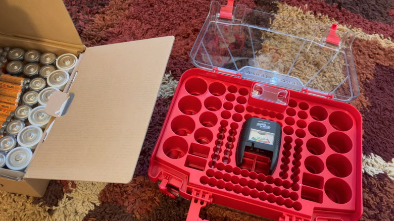 Battery Buddy with box of assorted batteries beside it