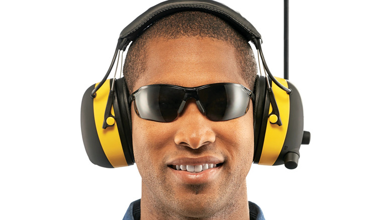 Man wearing safety glasses and ear protection