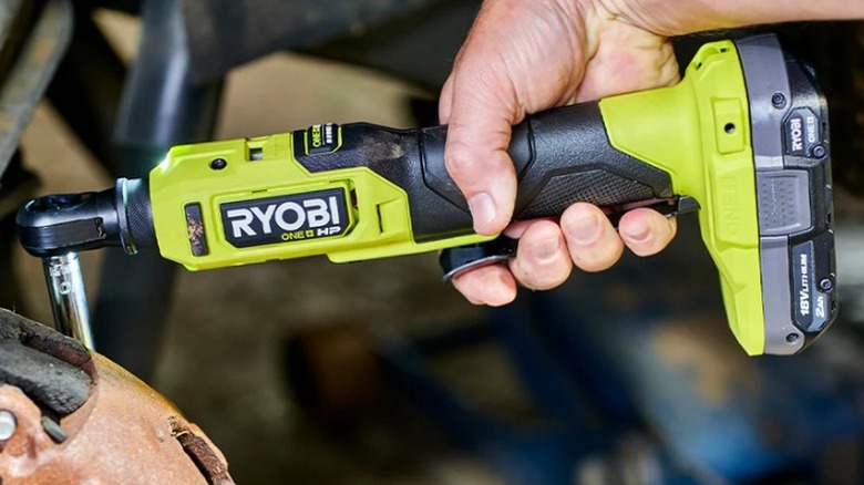 Person using Ryobi HP Compact High-Speed ¼-inch Ratchet on bolt