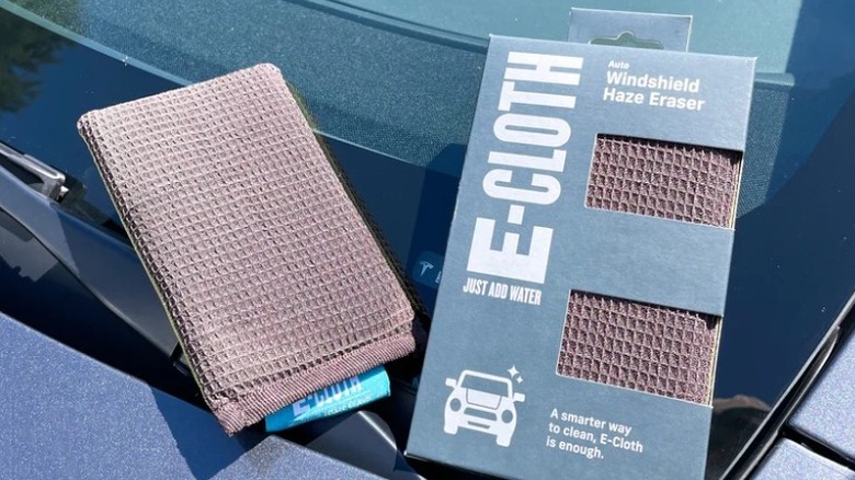 A microfiber towel on a car's windshield