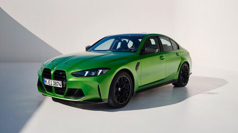A green 2026 BMW M3 parked for a photoshoot