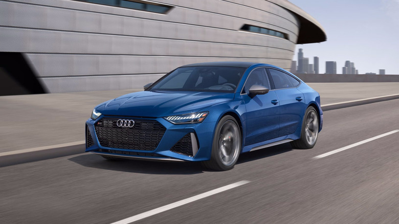 A blue 2026 Audi RS 7 driving