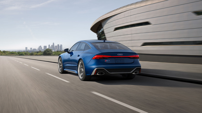 A blue 2026 Audi RS 7 driving