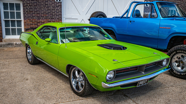 1970 Plymouth Hemi 'Cuda in Sub-Lime Green parked in front of house