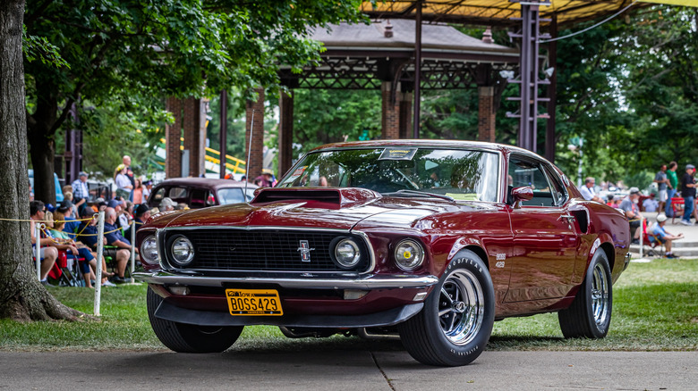 Maroon Ford Mustang Boss 429 on display at car show