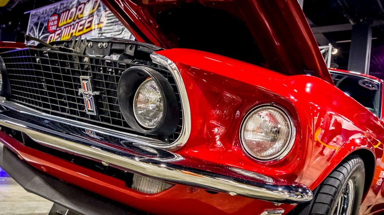 Close-up of the front fascia of a red Ford Mustang Boss 429 with the hood open