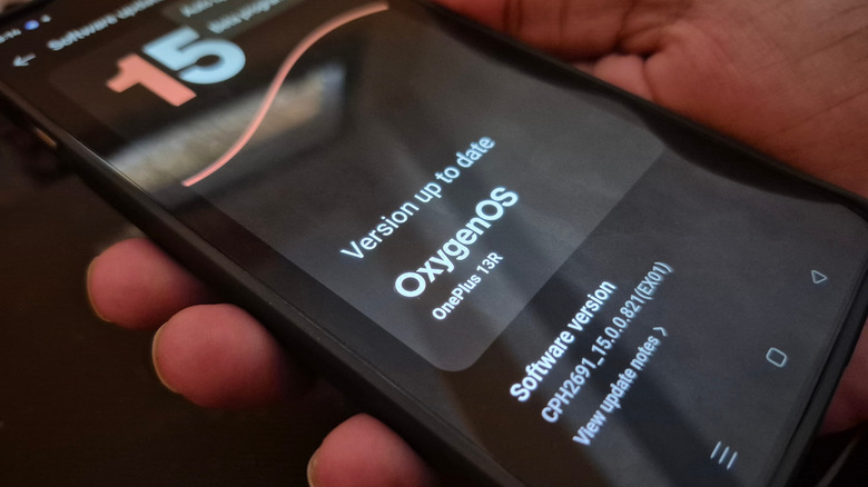 Close up image of a OnePlus 13R Smartphone updated to the latest version of OxygenOS based on Android 15. Technology and Security. Android update.