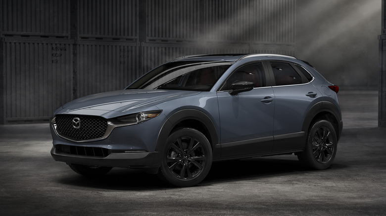 Blue 2026 Mazda CX-30 in a dark warehouse